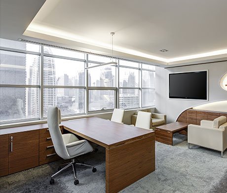 Luxurious executive office overlooking a modern city skyline.